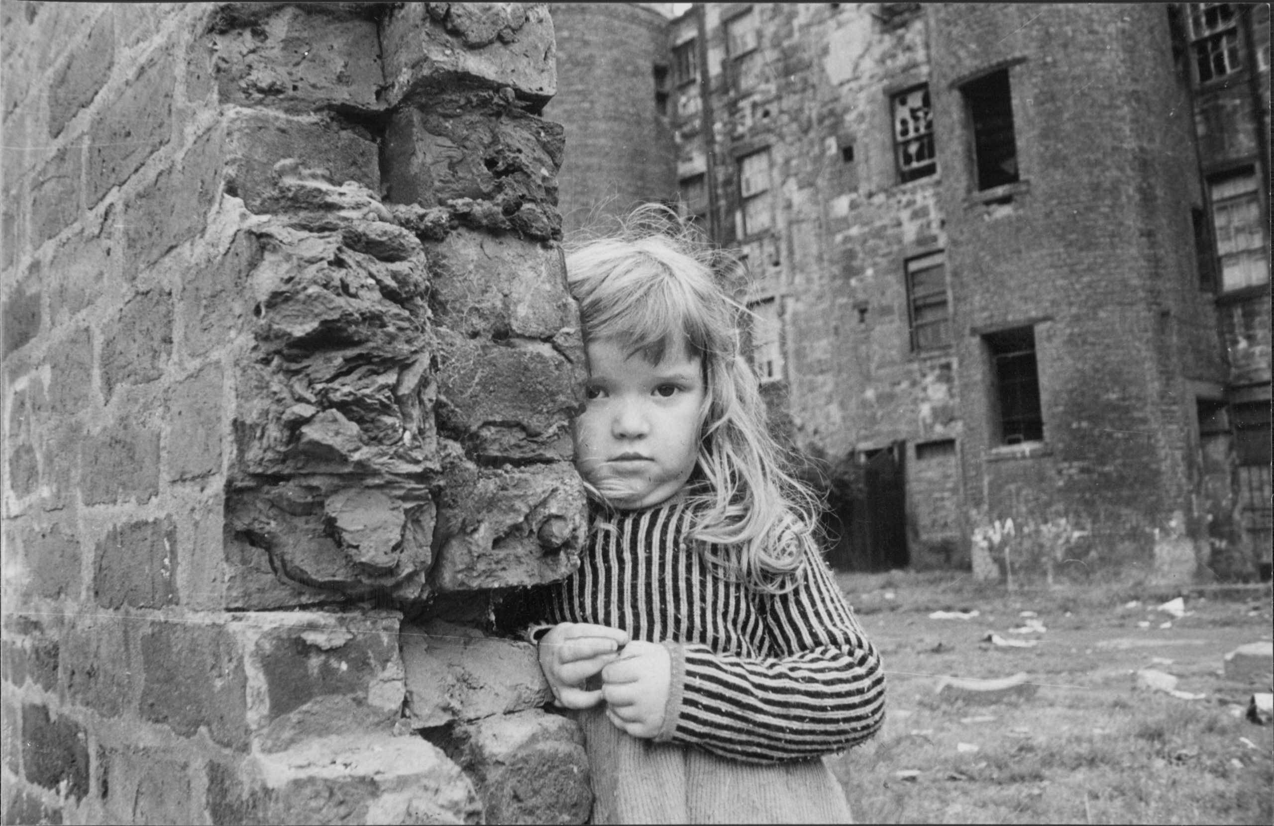 A little girl plays in the Gorbals, in Glasgow, before the stricken tenements were razed