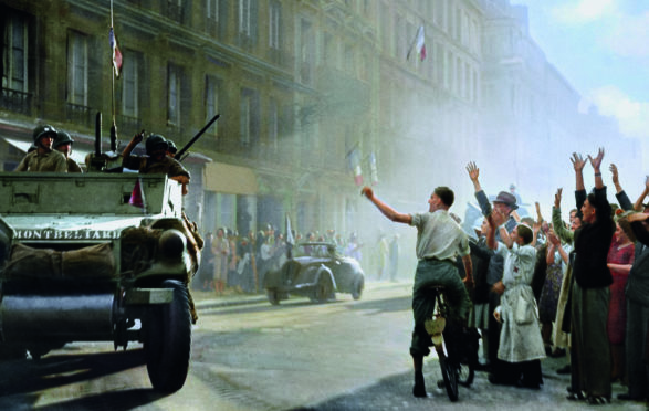 Historic image showing General Philippe Leclerc’s 2nd French Armoured Division arriving in Rue Guynemer to liberate                   Paris from Nazi occupation on August 25, 1944 is seen in full colour for the first time