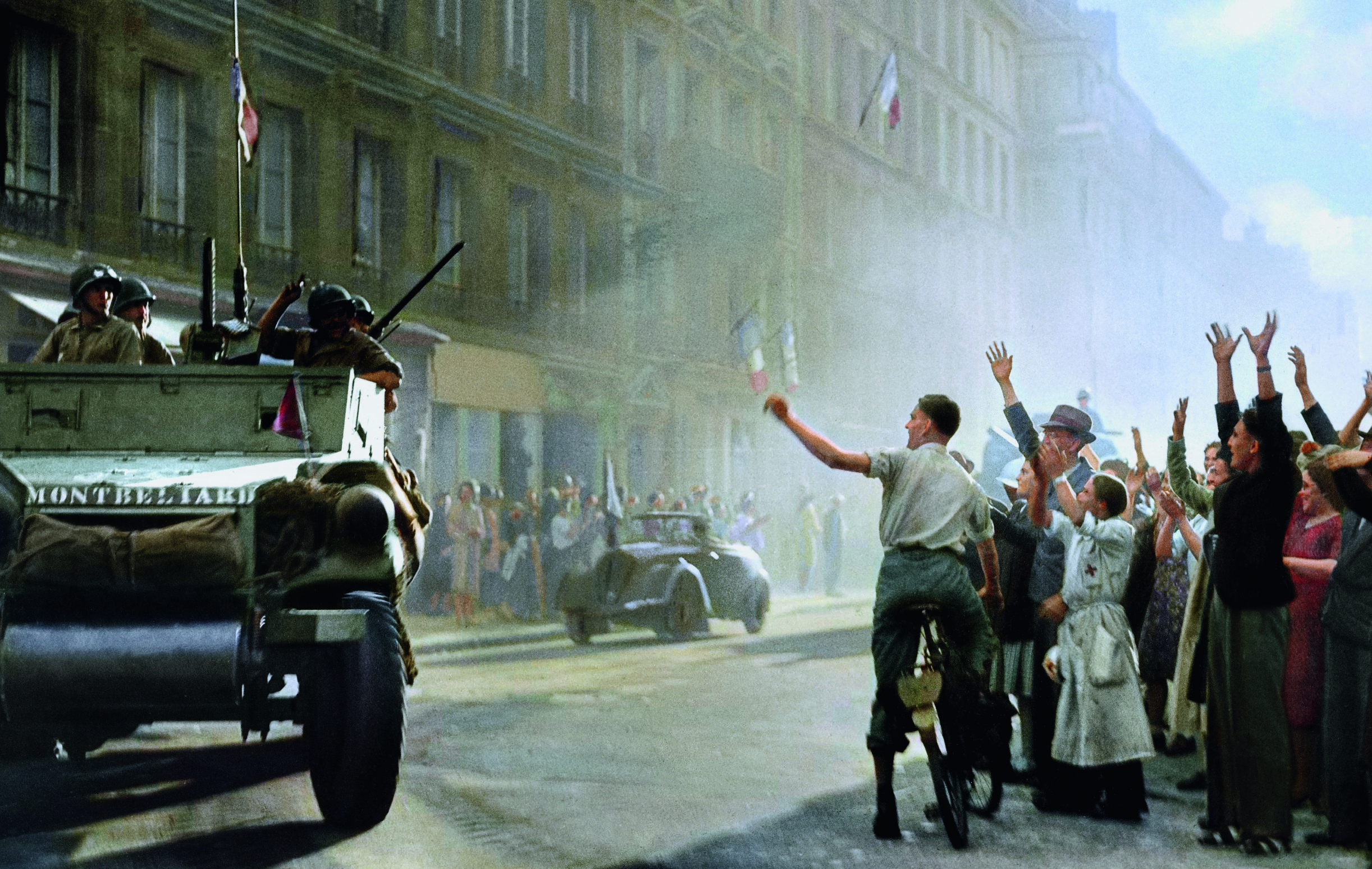 Historic image showing General Philippe Leclerc’s 2nd French Armoured Division arriving in Rue Guynemer to liberate                   Paris from Nazi occupation on August 25, 1944 is seen in full colour for the first time