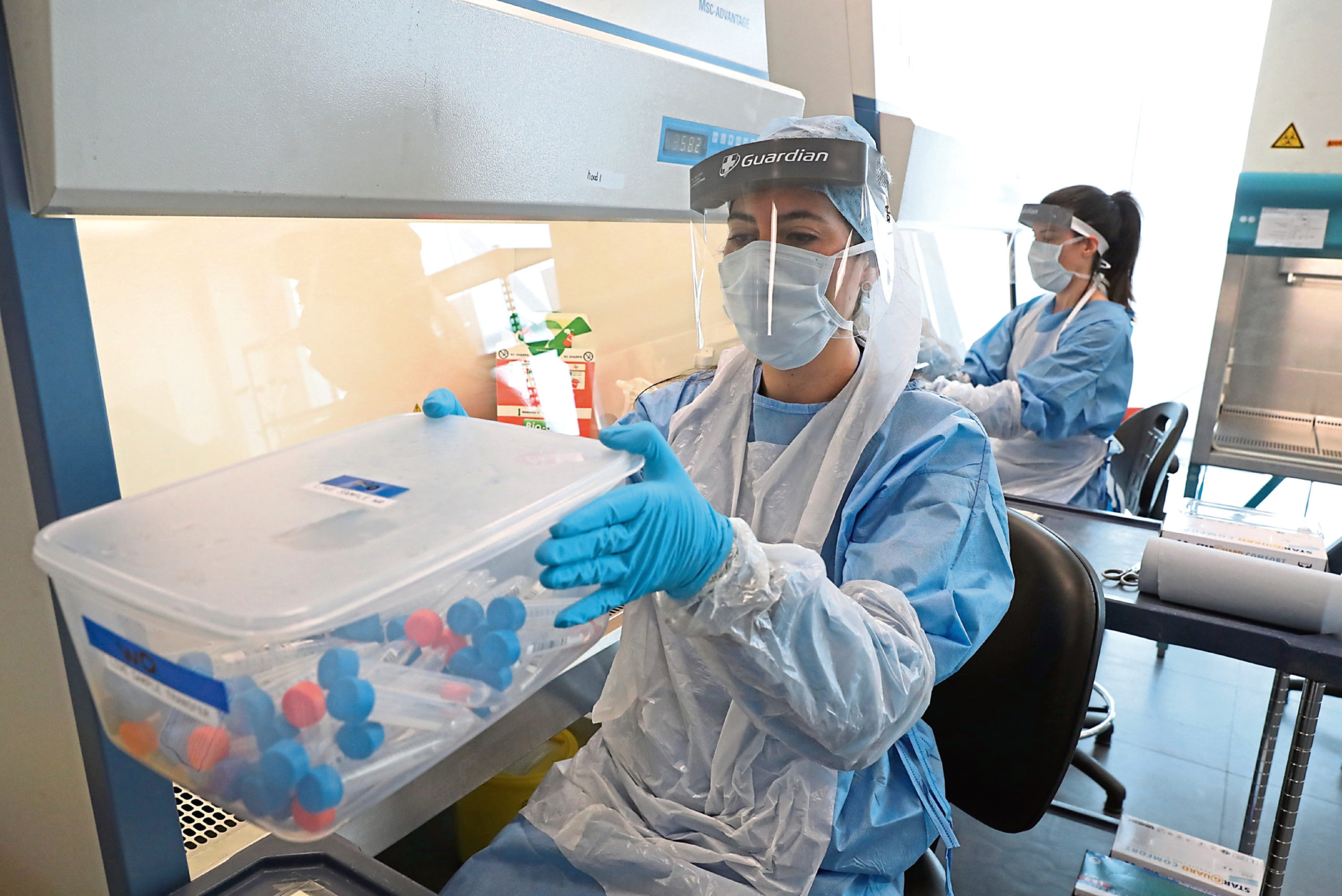 Scientists test Covid-19 samples at the laboratory at Queen Elizabeth University Hospital, Glasgow