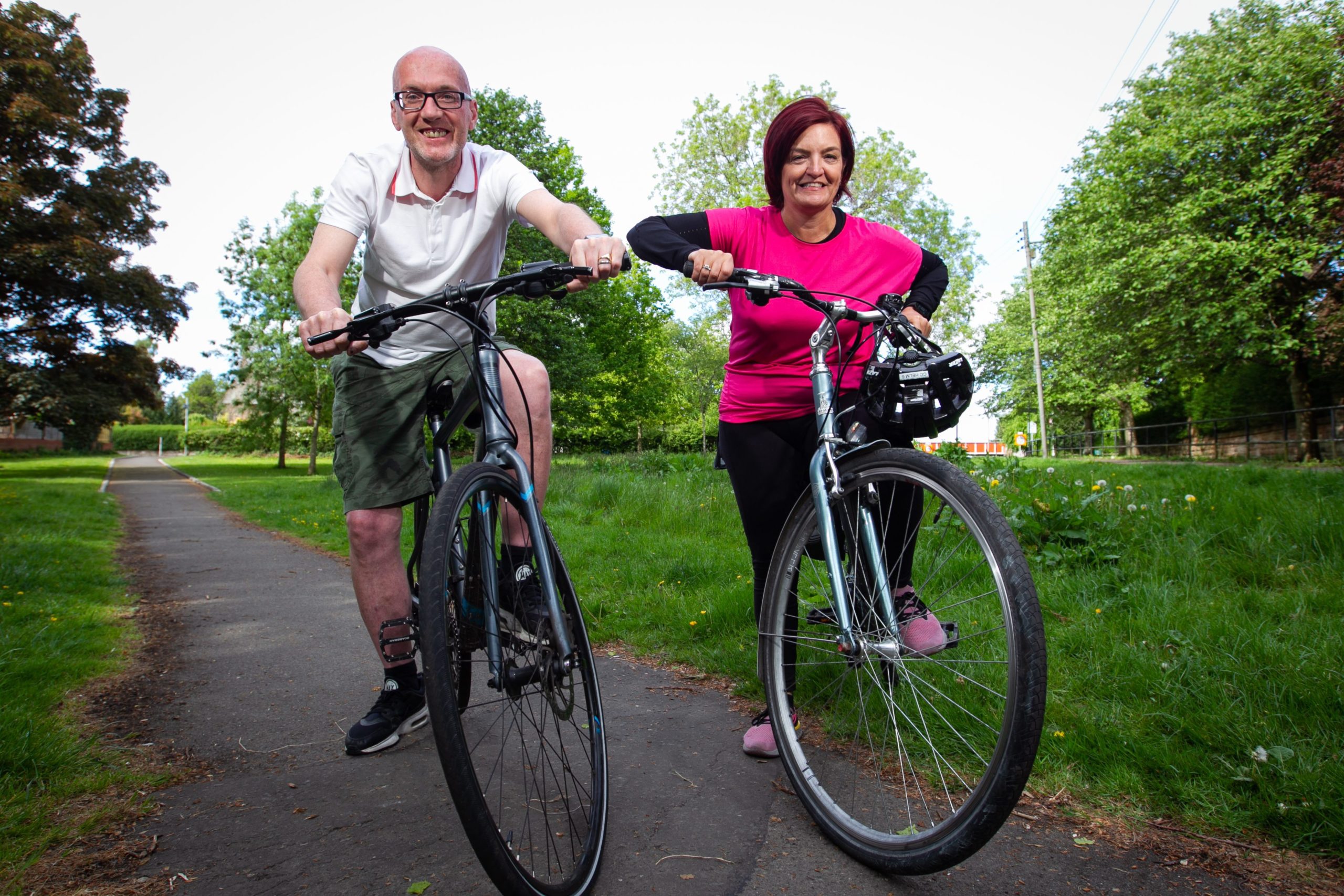 Postman Pat Mutter and charity service manager wife Sandra enjoying                        their weekend cycle around Glasgow