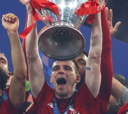 Andy Robertson lifts the Champions League trophy after Liverpool’s victory over Spurs last year