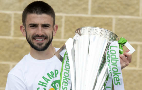 Greg Taylor with the Ladbrokes Premiership trophy