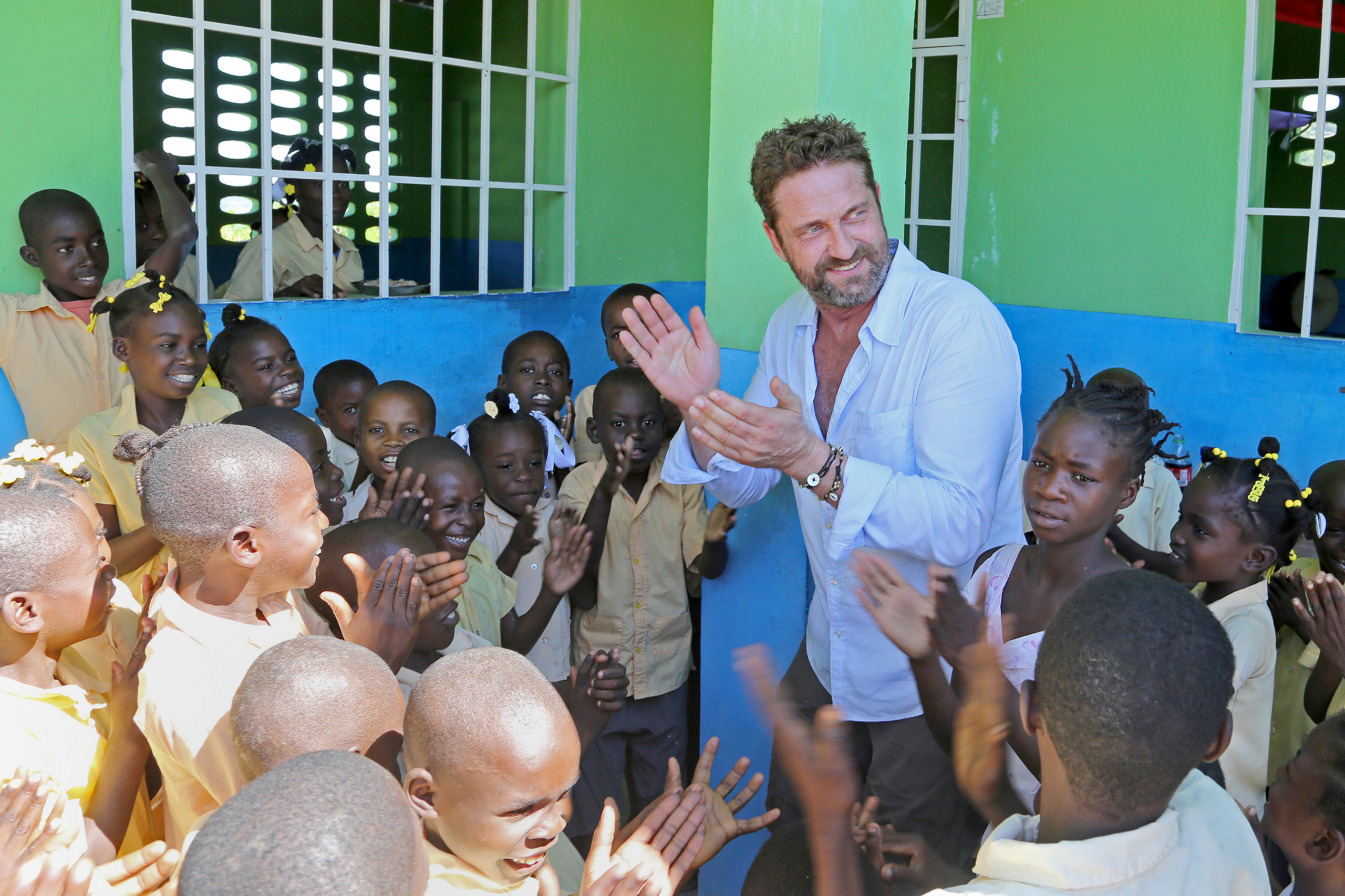Gerard Butler in Haiti helping the school feeding charity Mary's Meals