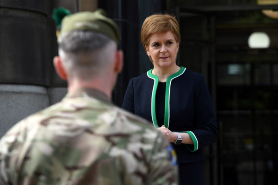 Scotland's First Minister Nicola Sturgeon speaks to members of the armed forces