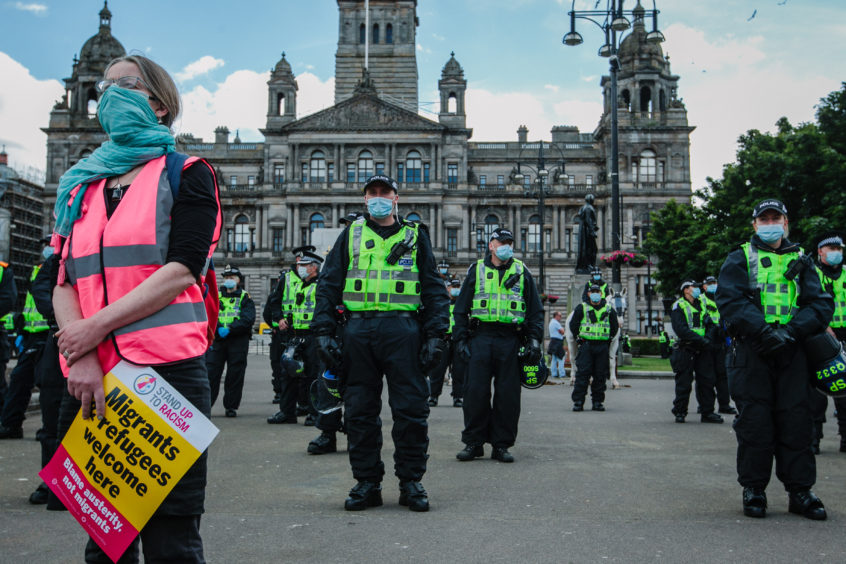 Police and demonstrators in George Square