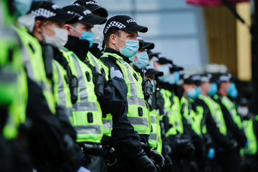 Police line up in George Square