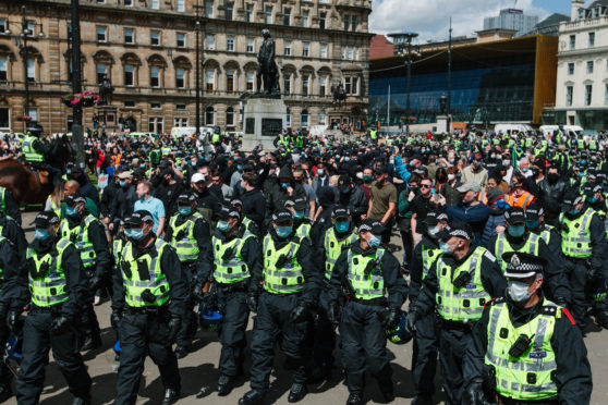 Police and crowds in Glasgow’s George Square