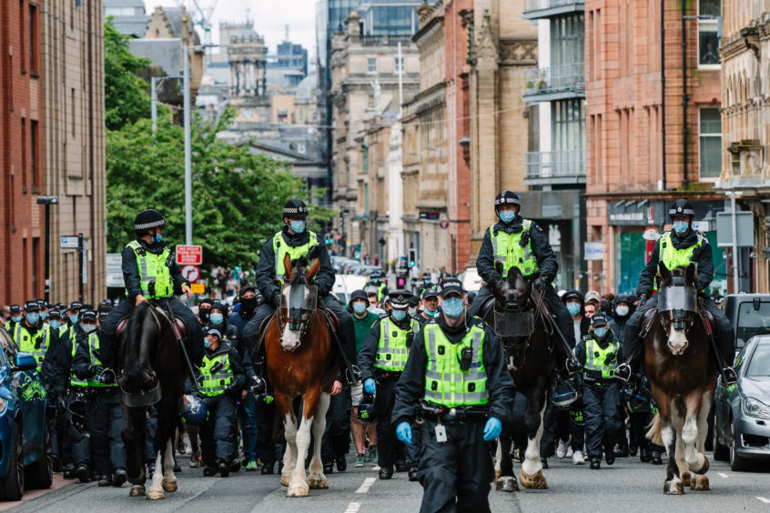 Police escort crowds