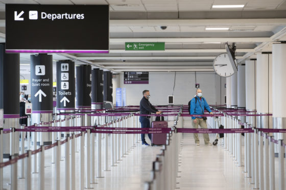 Passengers at the check-in area at Edinburgh Airport