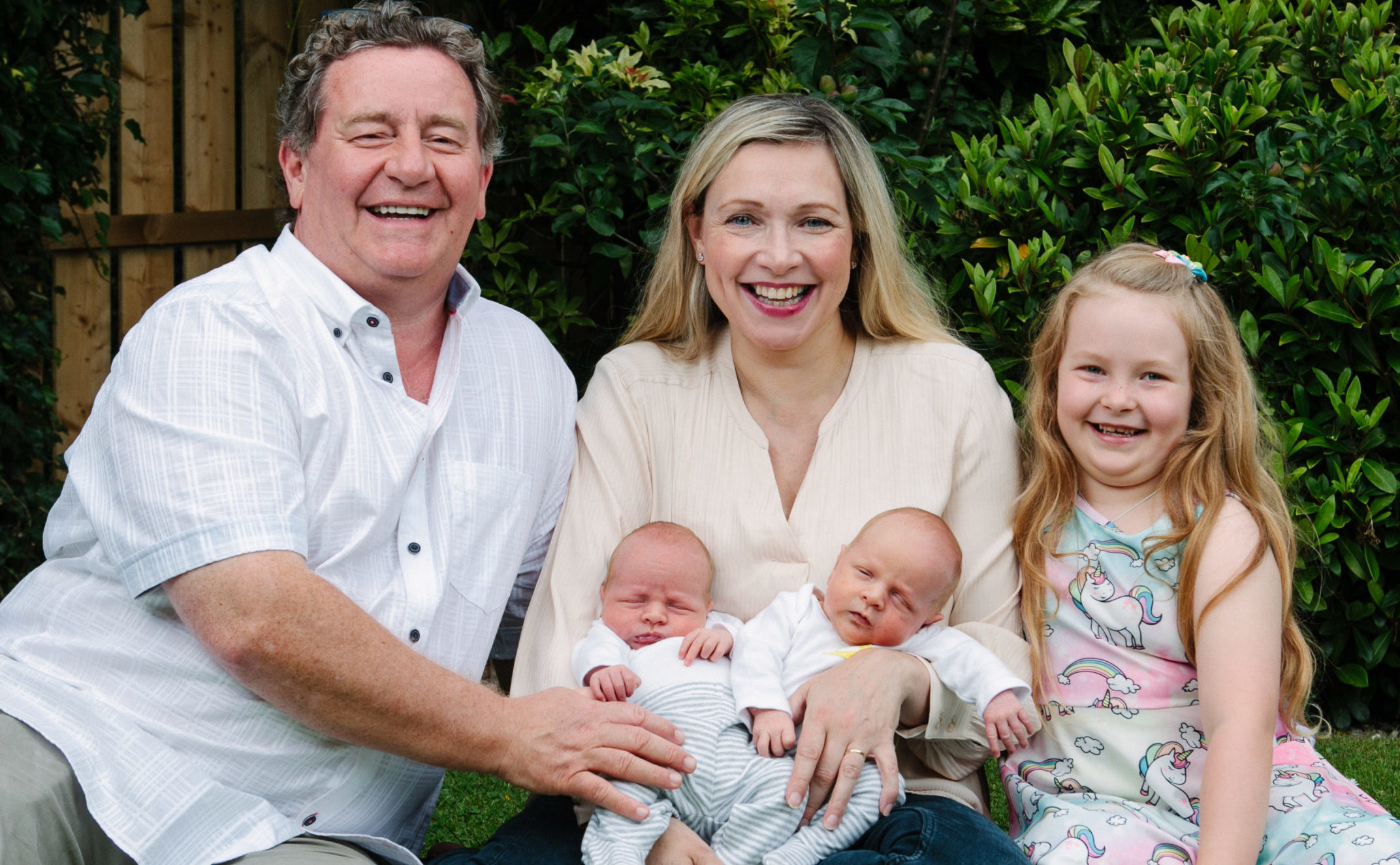Julian Queen at home in Glasgow with her husband Graham, daughter Amelia, and newborn twin babies Louis and Harris