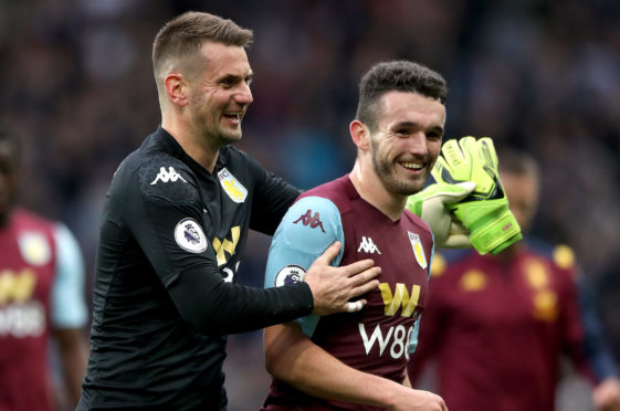 Aston Villa's goalkeeper Tom Heaton (left) and John McGinn during the Premier League match at Villa Park, Birmingham