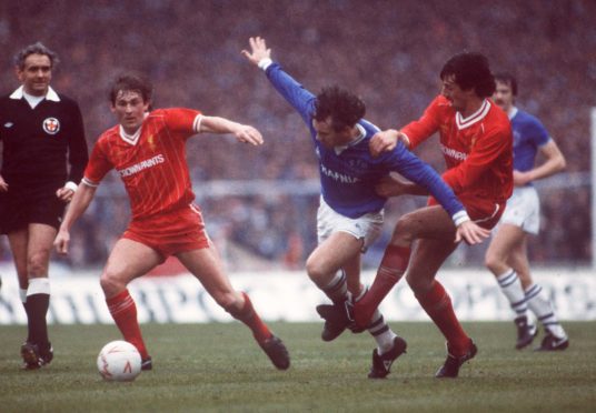 Peter Reid of Everton takes on Kenny Dalglish and Mark Lawrenson in a cup final at Wembley, 1984