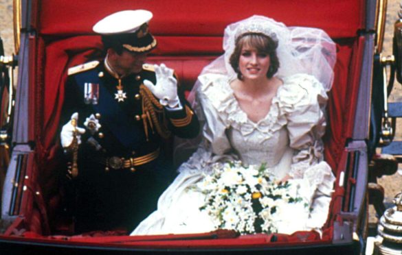 Princess Diana and Prince Charles wave to the crowds on their big day in 1981