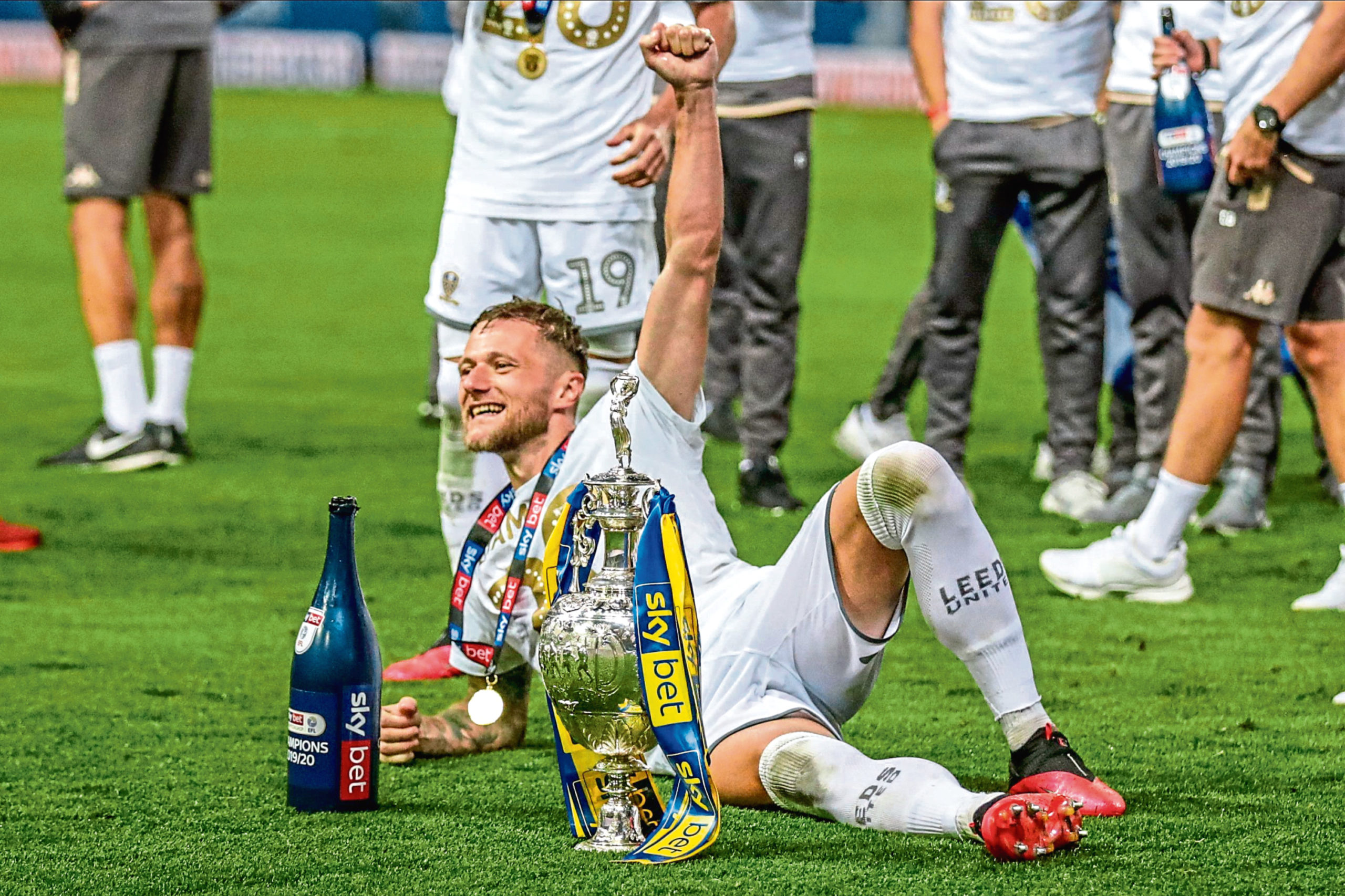 Liam Cooper celebrates Leeds United’s title success