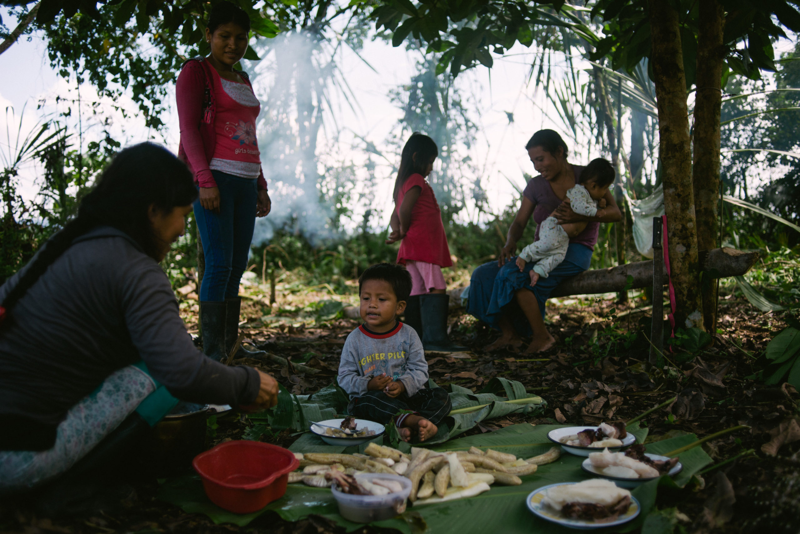 Families of the Wampis Nation prepare a meal in the Peruvian Amazon as legal action on lockdown looms