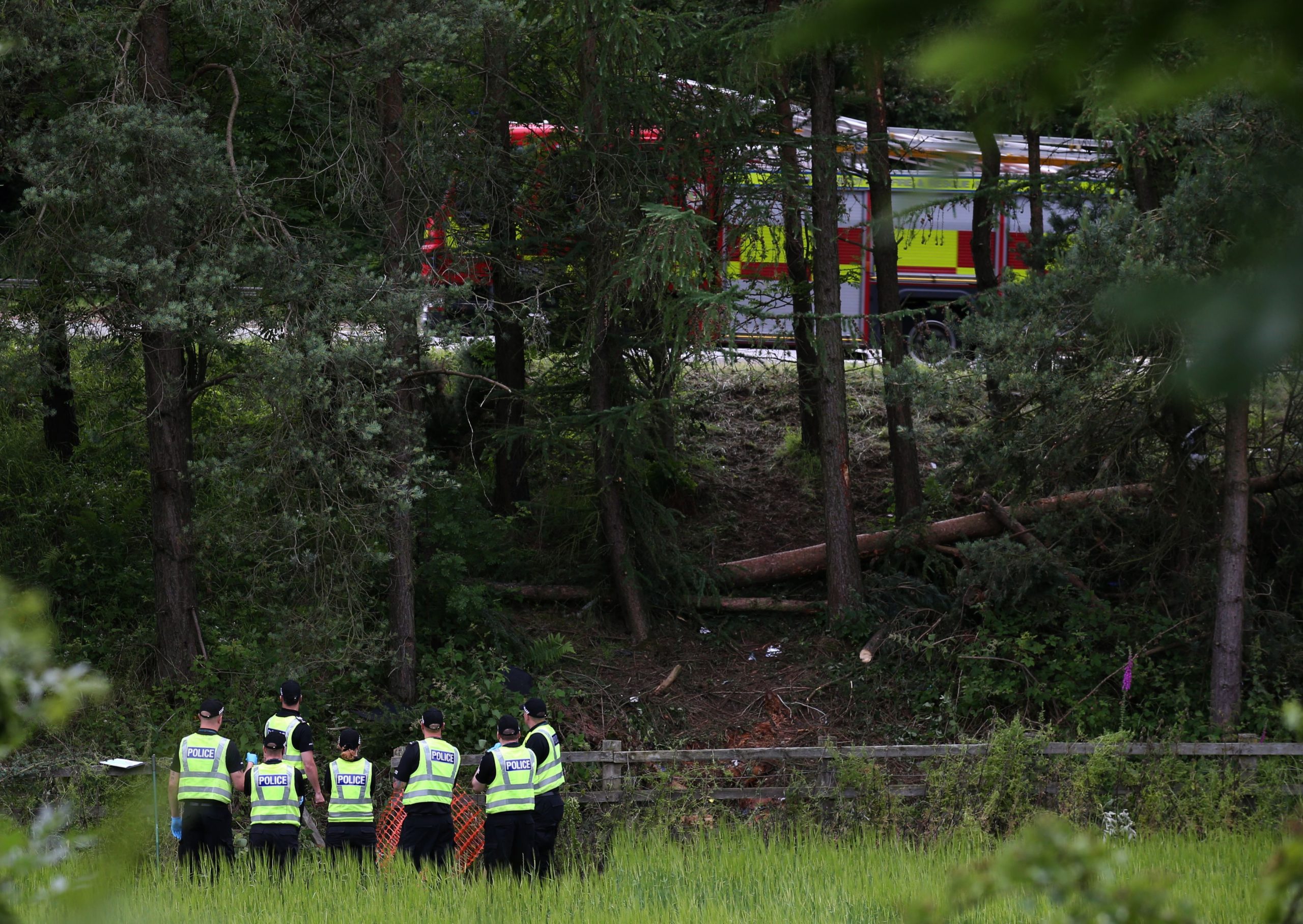 Police officers at the scene of crash tragedy near the M9 at Stirling on July 9, 2015, four days after the accident was first reported