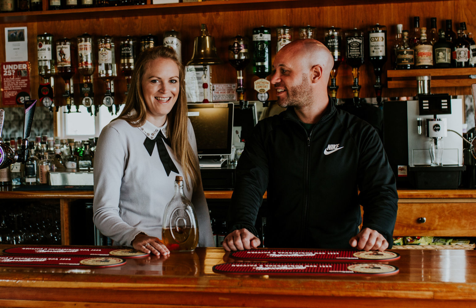 Co-owners Julia and Stephen Campbell, behind the bar of the Am Politician on Eriskay