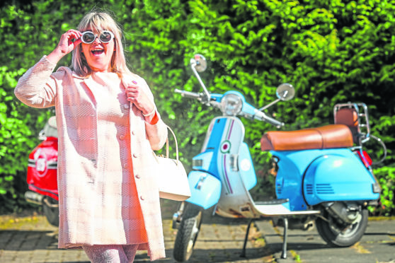 Lifelong mod Eve DePonio poses in front of her Scomadi TL and LML Auto scooters