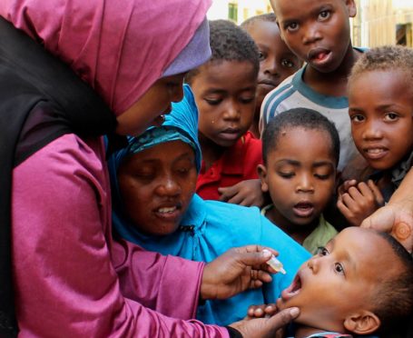 A child is given a polio vaccine in 2013 in Somalia, a country now poliovirus free