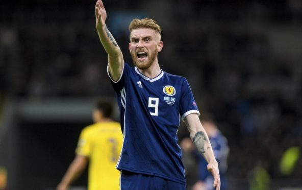 Oli McBurnie shows his passion for playing with Scotland