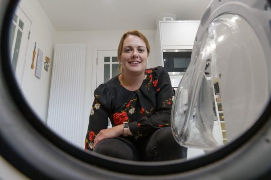 Teacher Jacqueline Masson in her Banff kitchen with new washing machine