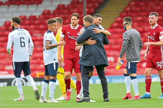 Smiles all round at Pittodrie as Steven Gerrard congratulates Leon Balogun on his debut