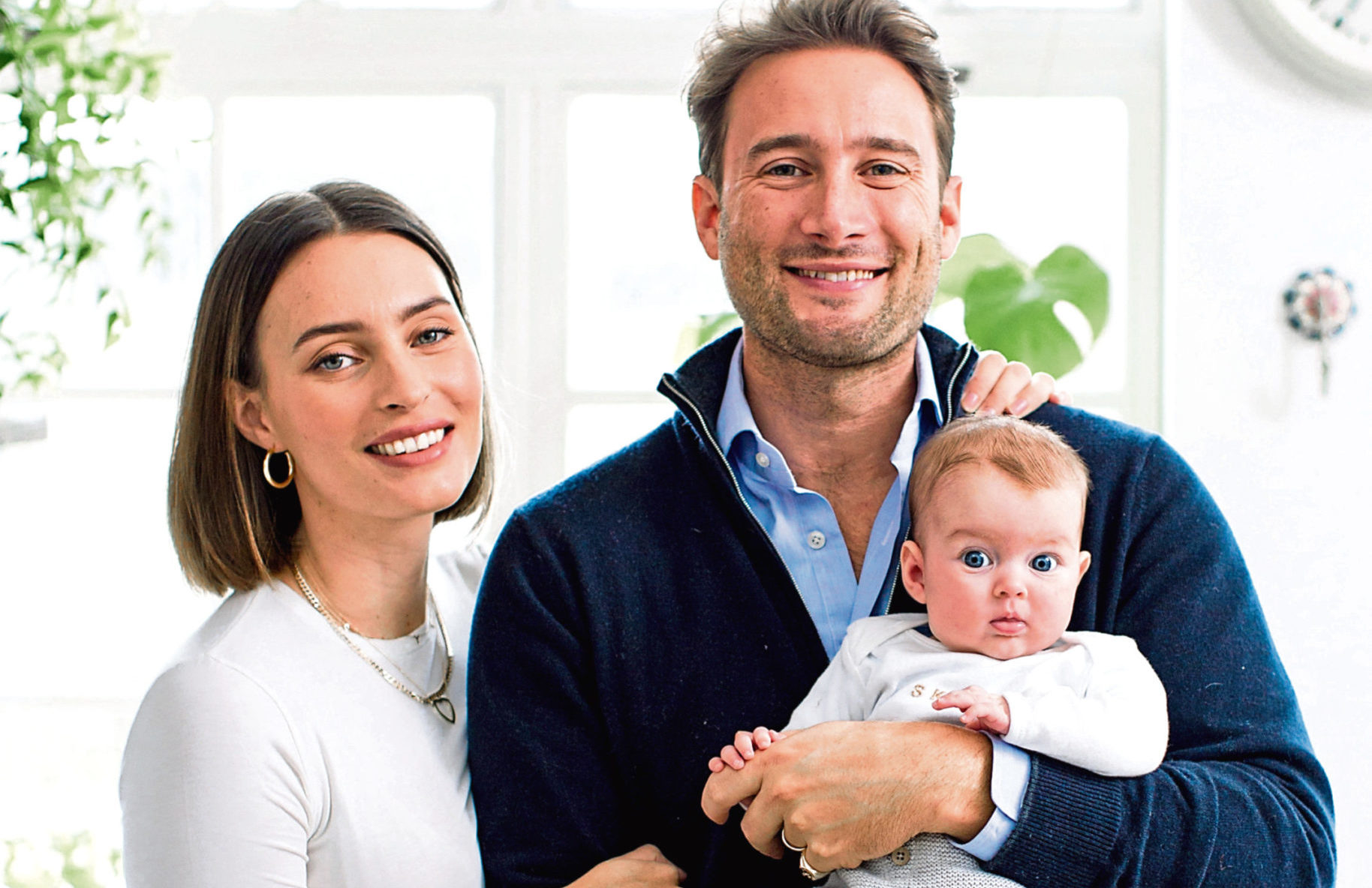 Ella Mills, creator of the Deliciously Ella food                         blog, with husband Matthew and one-year-old daughter Skye