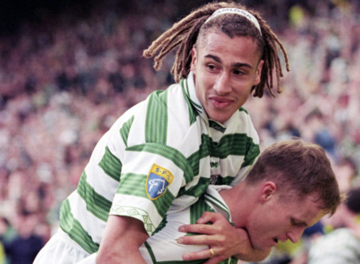 Henrik Larsson congratulates team-mate Harald Brattbakk on his clinching goal