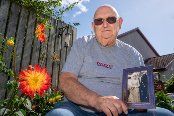 Ian Dall at his home in Balmullo in Fife, with a cherished photo of he and Wilma’s wedding day in 1966