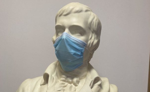 A statue of the poet has been given a face mask as the Robert Burns Birthplace Museum.