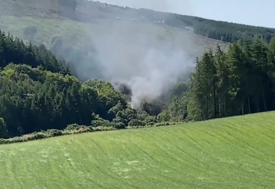 Smoke billowing from the train near Stonehaven, Aberdeenshire
