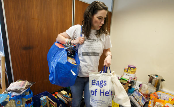 Selina Hales organises food deliveries inside a disused office block in Glasgow