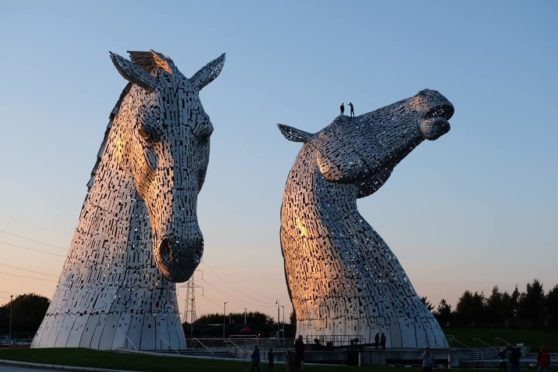 A picture circulating on social media shows two people on top of one of the Kelpies