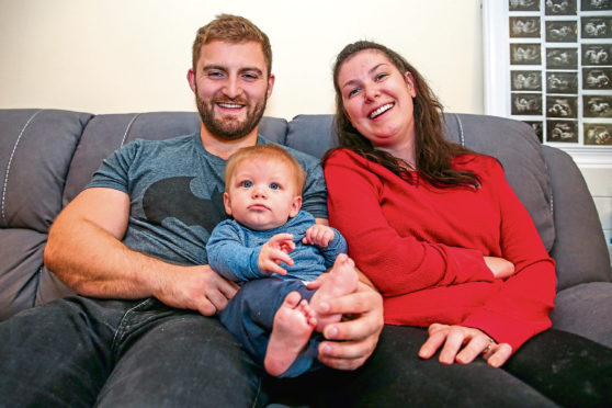 Lucy Lintott, Scotland's youngest MND sufferer and first to give birth post diagnosis celebrates the six-month landmark with her baby LJ and fiancé Tommy