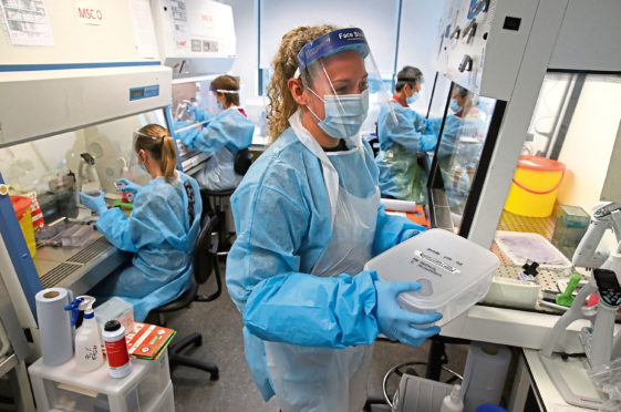 Scientists working at the Lighthouse Laboratory at the Queen Elizabeth University Hospital in Glasgow which receives and analyses coronavirus swabs with suspected COVID-19 infections in the continuing fight against the coronavirus.