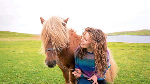 Catherine Munro who is writing a PhD on Shetland ponies. With 'Merkisayre Skerry', a 10yr old Stallion.