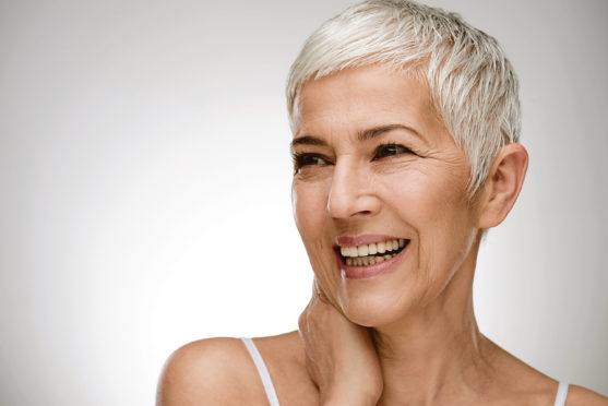 Portrait of beautiful senior woman in front of white background.; Shutterstock ID 1025380411; Purchase Order: -