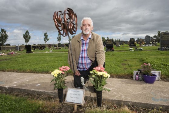 Larry Cullen at his mother Yvonne's grave at Pitkerro Grove Cemetery Dundee. She died after contracting Covid-19.