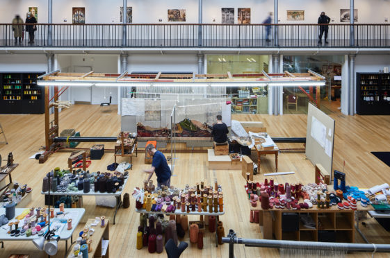 Weavers at work in Dovecot Studios