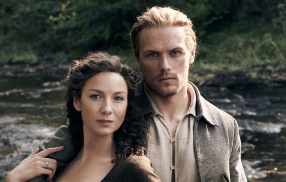 Sam Heughan and co-star Caitriona Balfe as Jamie and Claire Fraser in the hit series