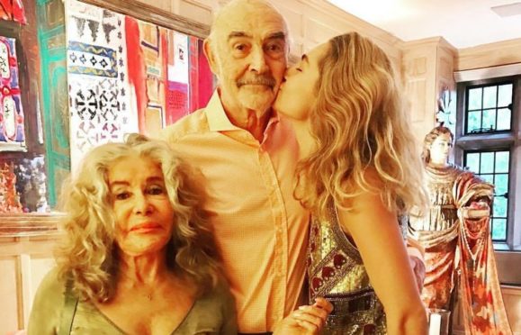 Connery’s granddaughter Saskia gives him a kiss in a picture posted on Instagram on his final birthday 
on August 25 this year, alongside 
wife Micheline