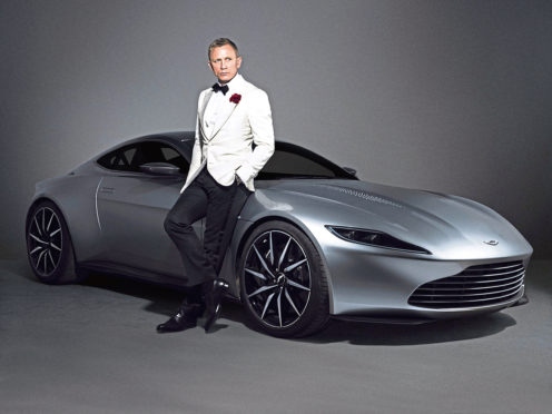 Daniel Craig with an Aston Martin DB10 as James Bond.