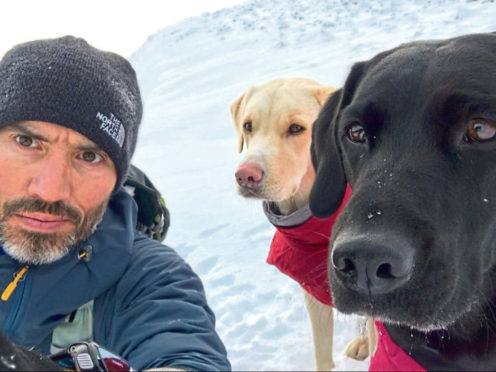 Andrew Cotter with his dogs.