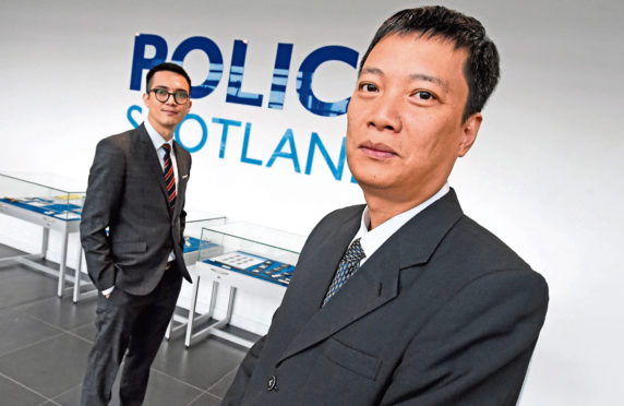 Vietnamese police officers Hiep Nguyen and Duy Nguyen at Police Scotland HQ in Dalmarnock, Glasgow