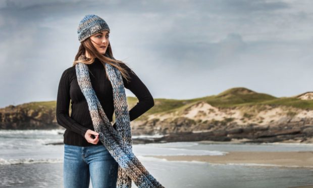 A model wears chunky knit anchor hat and scarf by Herring Girl Knitwear