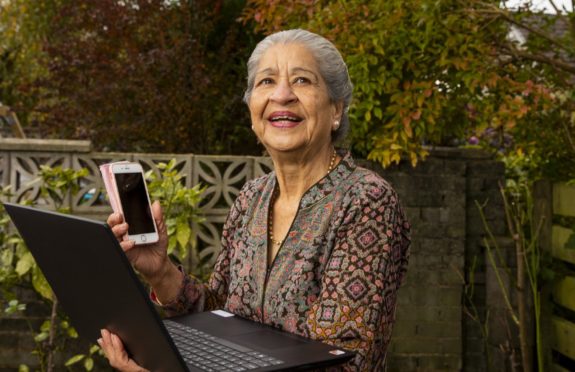 Brij Ghandi, from Bearsden, keeps in touch with friends and family on a laptop like many older people during lockdown