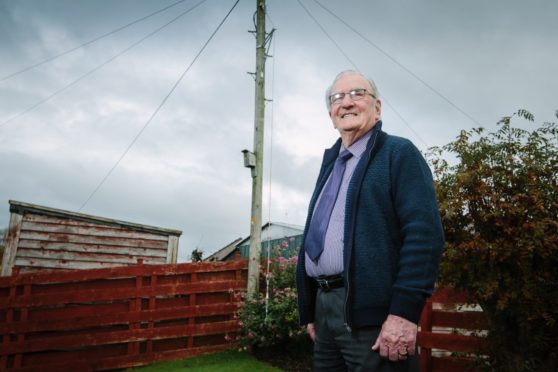 Andy Welsh by the pole in his garden in Locharbriggs