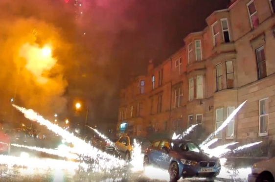 A firework explodes in Kenmure Street, Pollokshields, Glasgow at Halloween last year