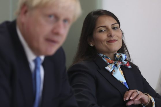 Prime Minister Boris Johnson and Home Secretary Priti Patel